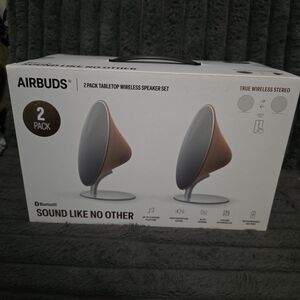 Brown and Silver Wireless Speaker Set